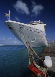 Detail of cruise ship bow moored to quayside