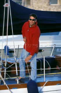 Crew attaches fenders at the right height for mooring. Musto crew in St Tropez, France