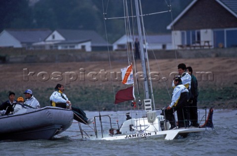 Crew on sinking yacht are rescued by race officials in a RIB