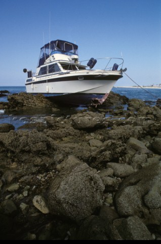 Power boat on the rocks