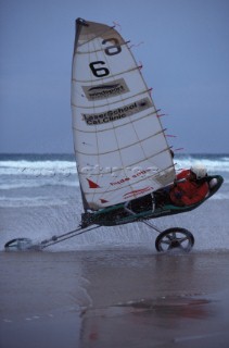 Land yachting on wet sand