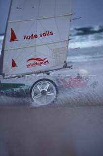 Land yachting on wet sand