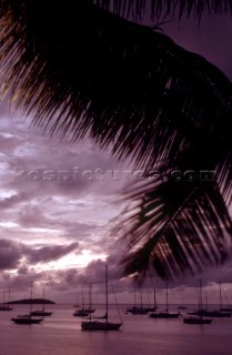 View of yacht anchorage from beach at sunset, St Maarten, Caribbean