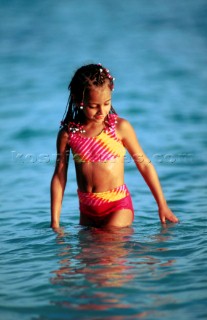 Child stepping out of the water Bahamas