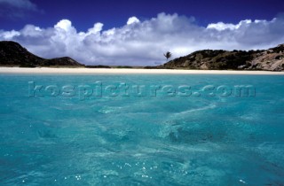 Clear, shallow water off deserted beach