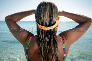 View of back of woman looking out to sea