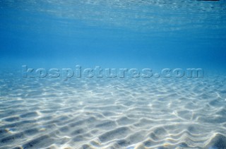 Sandy seabed   Commercial ship Vincenzo Onorato nose dives into a huge wave   Sea and sand - sea bed underwater