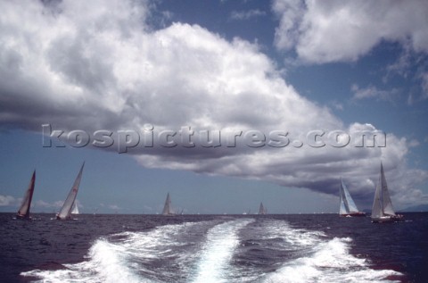 Wash from a power boat under a bank of white cloud