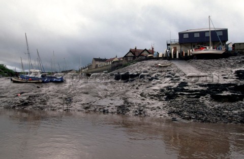 Fishing boats on the mud at low tide on the rive Avon Bristol UK