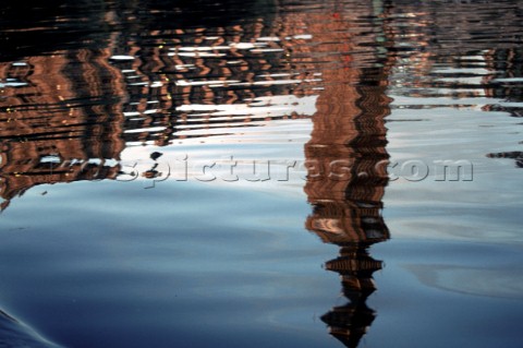 Reflection of buildings on the river Thames London UK