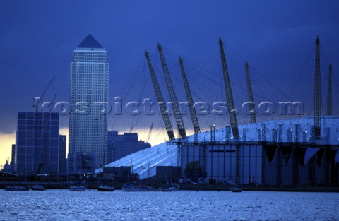Canary Wharf and the Docklands behind the Millennium Dome on the River Thames London