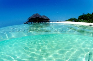 A wooden villa seen from water level, Maldives