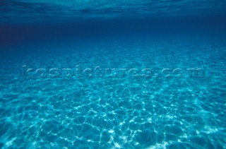 Reflection of surface on sandy bottom.