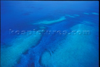 Sea by Coral Reef Patterns - Aerial