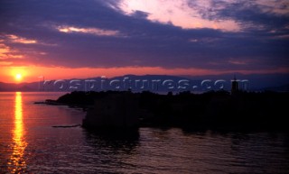 Sunrise over calm sea .