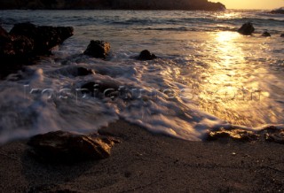 Sea lapping the shore on the island of Kos, Greece