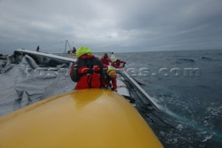 Crew repair daggerboard after collision with shark