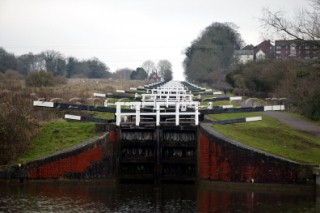 Devises Flight. Canal boat moored outside public house (pub).  Canal boats on English Kennet and Avon Canals.