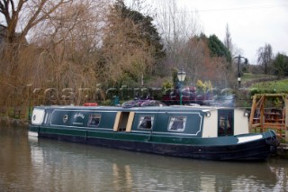 Canal boat moored outside public house (pub).  Canal boats on English Kennet and Avon Canals.