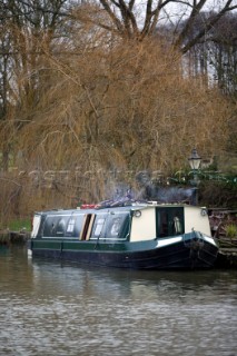 Canal boat moored outside public house (pub).  Canal boats on English Kennet and Avon Canals.