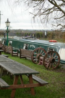 Canal boat moored outside public house (pub).  Canal boats on English Kennet and Avon Canals.