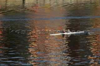 Two women in a Rowing scull on the River Thames.  Rowing pair.