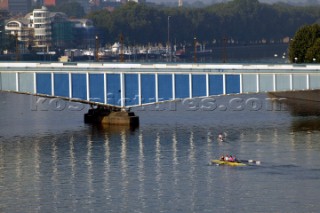 Two women in a Rowing scull on the River Thames.  Rowing pair.