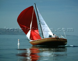 Sailing along in flat water and little wind until a gusts came and knocked this small boat down right at the finish line on the Great Salt Lake, Utah