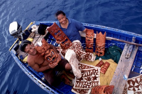 Locals come along side charter and pleasure boats selling their hand crafted art in Tonga