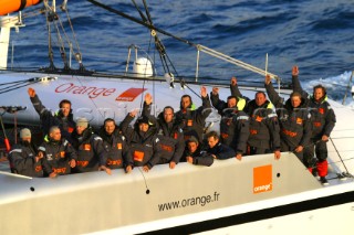 Maxi catamaran Orange skippered by Bruno Peyron crossing the startline of the Jules Verne