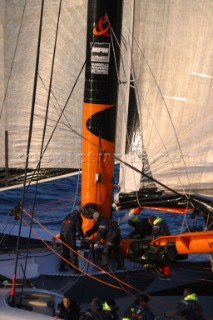 Maxi catamaran Orange skippered by Bruno Peyron crossing the startline of the Jules Verne