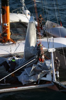 Maxi catamaran Orange skippered by Bruno Peyron crossing the startline of the Jules Verne