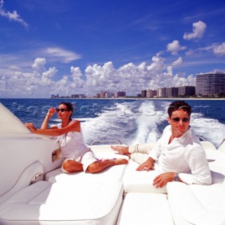 People relaxing in front of the Miami skyline