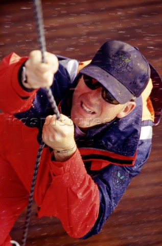 Man hauling up sail