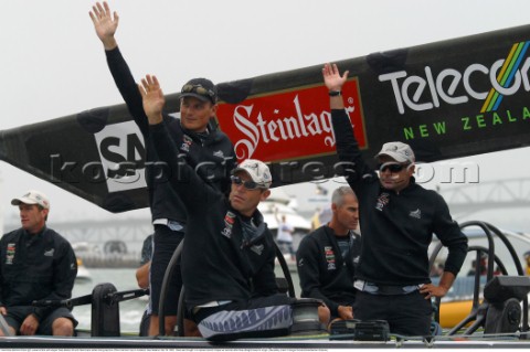 Frenchman Bertrand Pace right waves at fans with skipper Dean Barker left and Peter Evans center dur