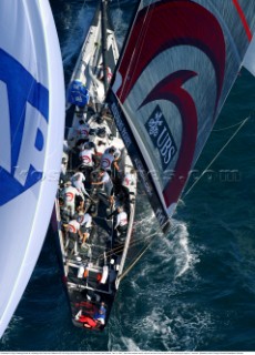 Switzerlands Alinghi Challenge fends off a challenge from Team New Zealands NZL-82 during race two of the Americas Cup in Auckland, New Zealand. Feb, 15. 2002.  Team New Zealand lead for most of race two to lose on the final down wind leg to Alinghi by 7 seconds. (Mandatory credit: © Sergio Dionisio/Oceanfashion Pictures)