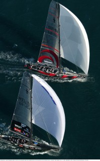 Switzerlands Alinghi Challenge head for the finish line along side Team New Zealands NZL-82 during race two of the Americas Cup in Auckland, New Zealand. Feb, 15. 2002.  Team New Zealand lead for most of race two to lose on the final down wind leg to Alinghi by 7 seconds. (Mandatory credit: © Sergio Dionisio/Oceanfashion Pictures)