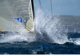 Team New Zealand crash though a wave during the per start of day one of the Americas Cup, Auckland, New Zealand. Feb, 15. 2002. Team New Zealand retired from the match after breaking a boom and damaging their head foil. (Mandatory credit: Sergio Dionisio/Oceanfashion Pictures)