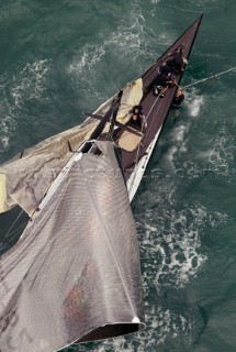 Crew member onboard Team New Zealands NZL-82 try to cut away the jib and main sail after breaking their mast during race four the Americas Cup in Auckland, New Zealand. Feb, 28. 2003. Team New Zealand suffered their second breakage of the event to trail Switzerlands Alinghi Challenge 4-0 in the best of nine races. (Mandatory credit: © Sergio Dionisio/Oceanfashion Pictures)