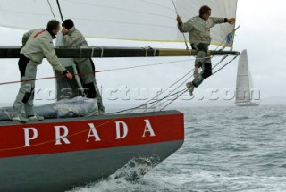 Italys Prada Challenge bowman Paolo Bassani sits on the spinnaker pole in perparation for testing after racing was called of on race day one of the Louis Vuitton Cup, Quarter final repechage.Auckland, New Zealand. Nov, 23. 2002  . (Photo credit: Sergio Dionisio/Kos Picture Source)