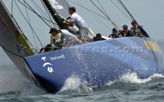 Americas Oneworld Challenge skipper Peter Gilmore right, guides USA-67 around the top mark during the Louis Vuitton Cup, Quarter final repachage in Auckland, New Zealand. Nov, 29. 2002  (Manditory credit: Sergio Dionisio/Oceanfashion Pictures)