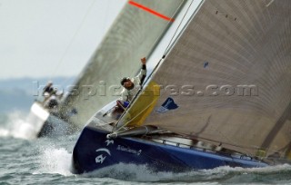 Amerikcas Oneworld Challenge bowman Alan Smith perpare to set the spinnaker as they lead Team Dennis Conners Stars & Stripes during the Louis Vuitton Cup, Quarter final repachage in Auckland, New Zealand. Nov, 28. 2002