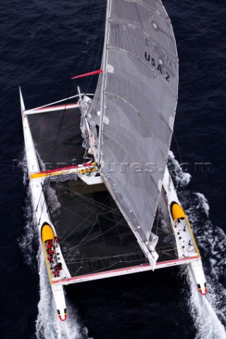 Maxi Cat Cheyenne owned by American Steve Fossett crosses the Finish after a record round the world 