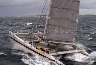 Maxi Cat Cheyenne owned by American Steve Fossett crosses the Finish after a record round the world non-stop voyage of 58 days, 9 hours, 32 minutes and 45 seconds.