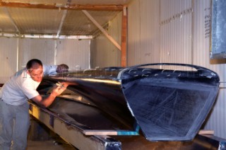 Paul Larsen (AUS) working on  SAILROCKET under construction in Southampton at NEG-MICON facility.