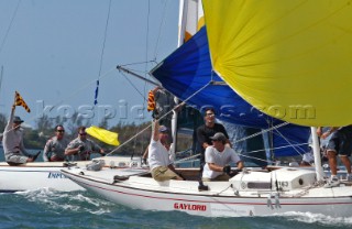 New Zealanders Cameron Dunn centre, and Russell Coutts of Team Alinghi both hold up a flag in protest as they battle to advance into the quarter finals of the Investors Guaranty presentation of the King Edward VII Gold Cup 2003, Royal Bermuda Yacht Club, Hamilton, Bermuda. Oct, 22nd. 2003 . Coutts narrowly defeated Dunn 3-2 in a thrilling round which saw both sailor penalised.