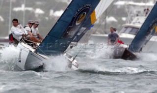 In wind of 20-25 knots Australias Peter Gilmour of Pizza-La Sailing Team leads New Zealands Chris Dickson of Team ORACLE BMW Racing during the finals to win the Investors Guaranty presentation of the King Edward VII Gold Cup 2003, Royal Bermuda Yacht Club, Hamilton, Bermuda. Oct, 26th. 2003   .