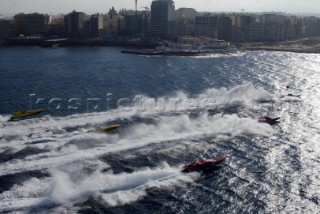 Aerial shot of powerboat fleet racing towards Valletta harbour, Malta