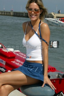 19.6.04, Fiumicino, Rome: the P1 promotional girls enjoy the sunshine and the boats in the dock as the boats prepare to go out.