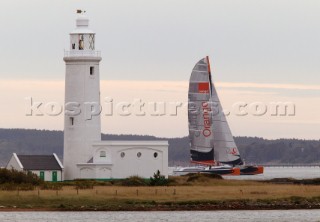 Round the Isle of Wight Race 2004 organised by the Island Sailing Club. Maxi cat Orange passing Hurst Castle attempting a new race record.